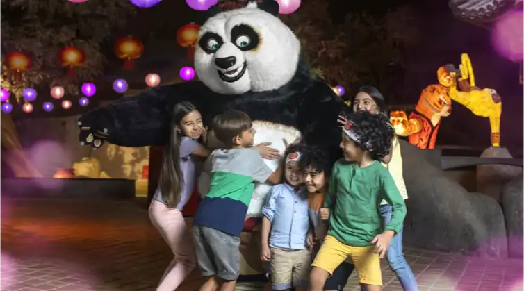 children hugging Kung Fu Panda at Motiongate Theme Park Dubai