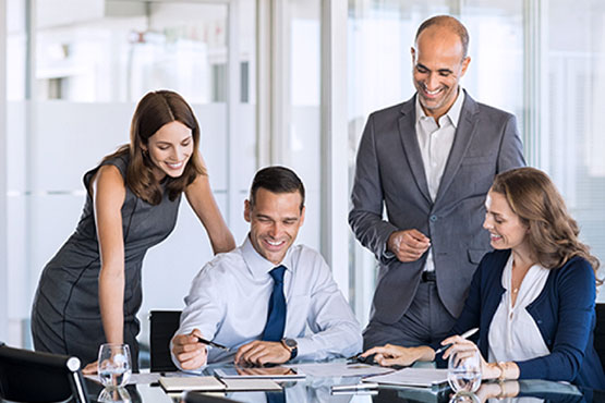 Bell experts discussing analytics in a meeting room