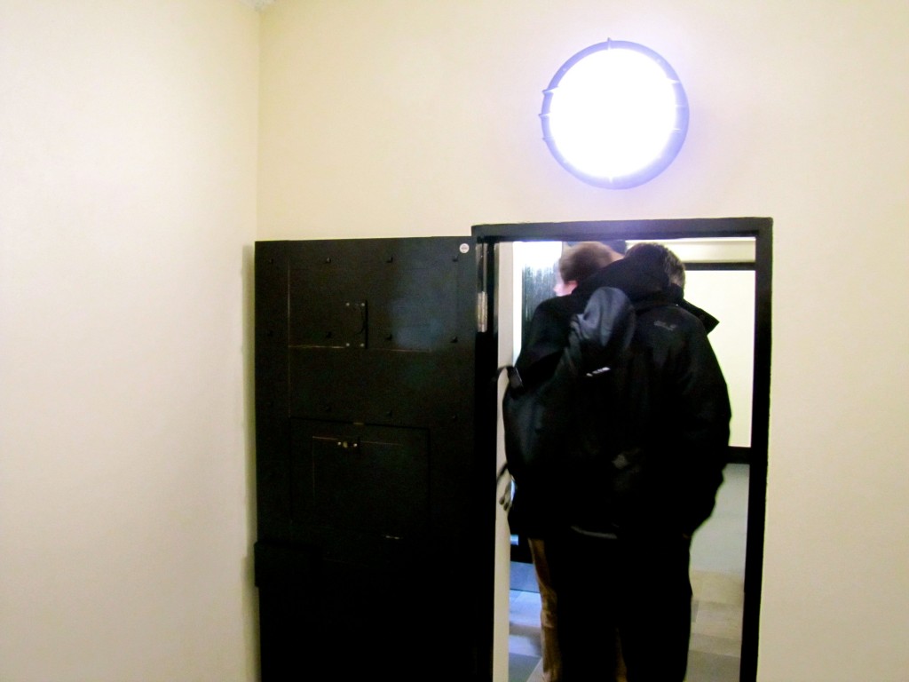 The door to the little holding cell - tiny door, and a cell about ten feet square. They were intended for about ten prisoners, and were segregated. Normally, men and women were separated, but when the Troubles heated up, the segregation was between Unionists and Republicans.