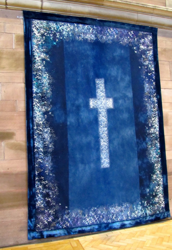 This tapestry was made to honour those people lost when the Titanic went down. The edge and the big cross in the middle are made of a myriad tiny white and silver crosses.