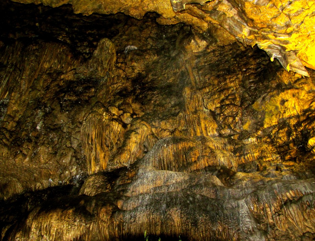 A big chunk of the ceiling collapsed here long ago, and more flowstone formations built up on the sheer wall of the rift. "I think," says our guide, "that some of you maybe are getting a little concerned with how often I'm using the word 'collapsed.'"