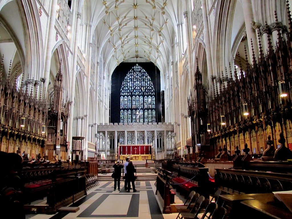 This is the Quire, or Choir. They spell it with the Q in York. It's where the clergy and chorus sit when there's a full service, though attendance these days means that entire services are held here. You can see the crests for various clerical positions and bishoprics along the back row. This is the area below the central tower, behind the screen with the statues of church primates. It's big enough to be a church all on its own.