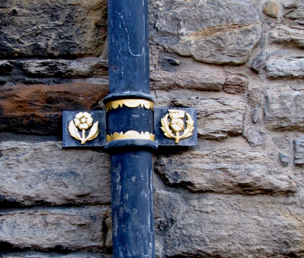 The decorations on the hall feature both the rose and the thistle, emblems of England and Scotland.