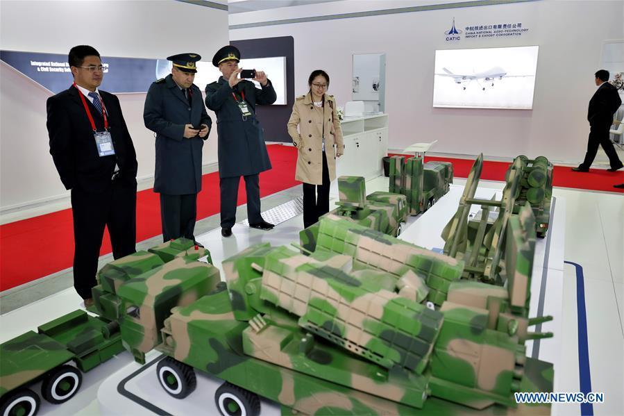 People look at the exhibits of a Chinese company at the Kazakhstan Defense Exhibition in Astana, capital of Kazakhstan, May 23, 2018. Seven Chinese military trade companies took their best products to participate in the exhibition held in Kazakhstan from May 23 to 26. (Xinhua/Aibek Abilov)