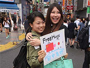 Chinese and Japanese Youth Embrace in Tokyo