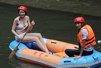 Bikini beauties lifeguards in river rafting place