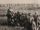 Photo taken during an actual assault. The column in the foreground waits in reserve as echeloned waves of assault troops advance.