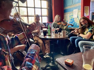 Playing in a session in Charlie’s, my old watering hole in Cork from my Art College days three decades ago.