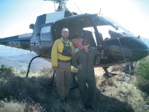 R to L: Desiree Horton poses with Don Sharlow, helicopter manager of the Cave Creek Complex fire, near Carefree, Ariz. The fire covered more than 150,000 acres in Arizona.