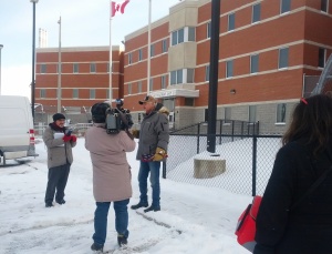 Albert speaking to the crowd and media outside the Brockville Mental Health Centre. Photo Credit: Julie Comber