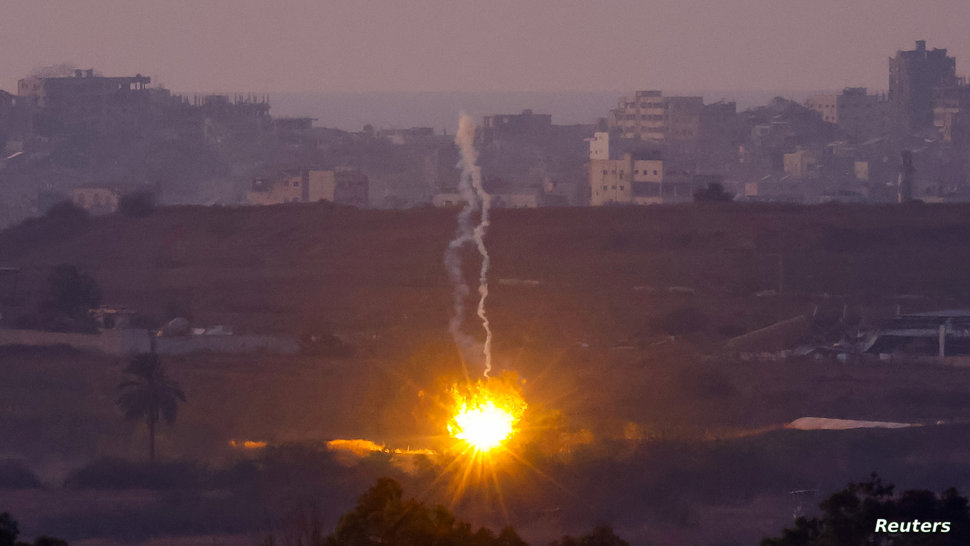 A flare falls in central Gaza, amid the Israel-Hamas conflic