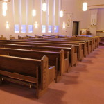 Left aisle showing completed pews after their retrofit