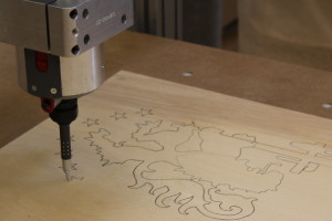 CNC used to draw patterns on plywood