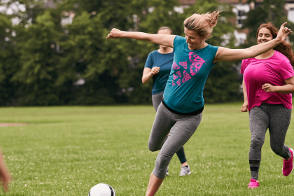 TIED Woman ready to shoot football