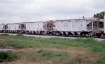 A string of dry rock cars