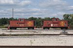 A pair of ATSF cabooses