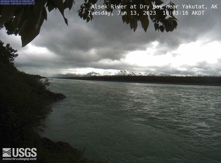 Looking at a large body of water with mountains in the distance.