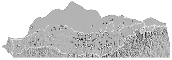 A gray map of the northern part of Alaska showing mountains in relief and dotted with open circles and cross symbols