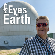 man standing in front of dome overlaid with logo