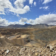 Open pit rare earth element mine at Mountain Pass, California. Stepped sides of the pit and access for mining vehicles shown.