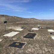 rectangular plots, some small and some large, some covered in white gravel and some in black