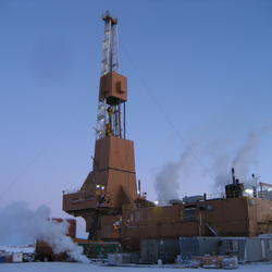 Image shows a drill rig on a snowy landscape