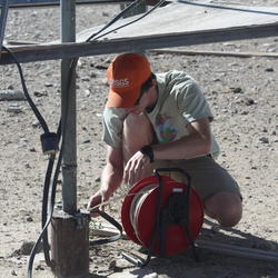 Measuring water levels at a Summit Springs Canyon well in the Black Rock National Conservation Area, Nev.