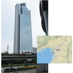 The 55-story tall building in Osaka, Japan, and a map with a red star at the location of the building. (Photo by Mehmet Çelebi)