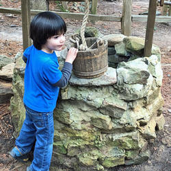 Groundwater: Child about to get water from a groundwater well.