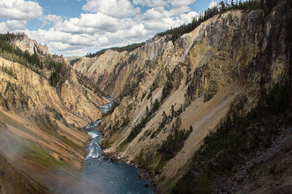 A river flows through a canyon into the distance.