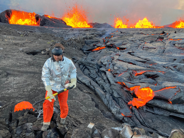 Color photograph of scientist and lava