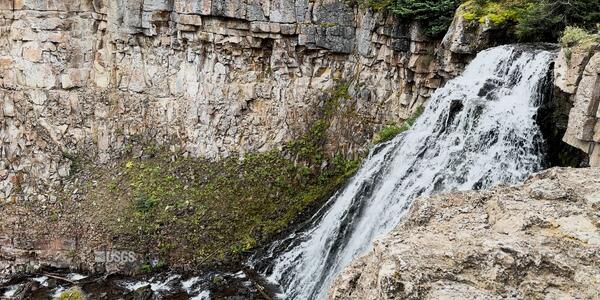 A waterfall flows from right to left of the screen.