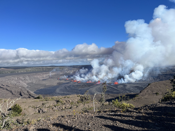 view of the summit eruption at Kīlauea showing fissures and lava