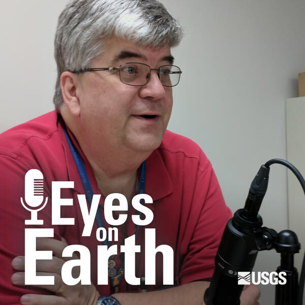 Color photo of Jon Christopherson with USGS EROS "Eyes on Earth" graphic