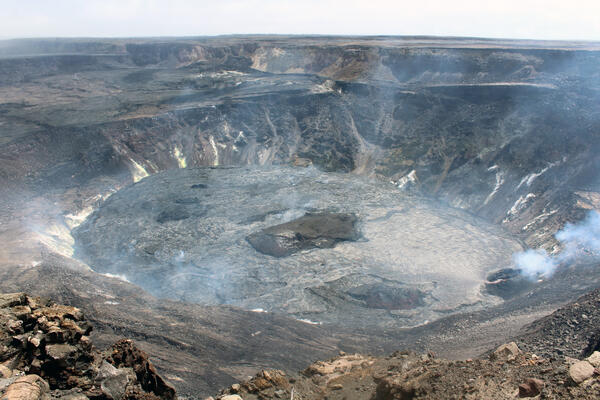 A wide view of a lava lake within Halemaumau crater