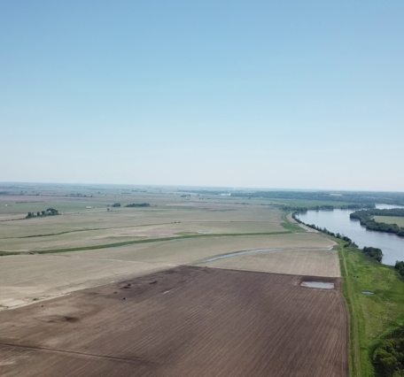 UAS-captured photo showing another UAS with hyperspectral payload approaching the Missouri River.