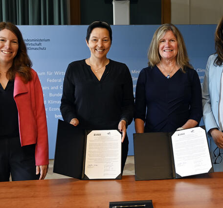 Photo of USGS and German Aerospace Center sign statement of intent for upcoming Landsat Next mission.
