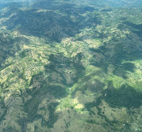 green and brown mountains aerial view in puerto rico