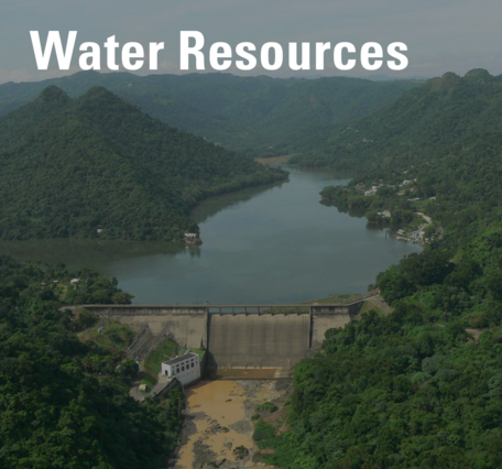 a dam between vegetated hills and the words 'water resources'