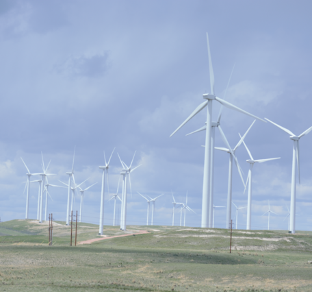 Wind turbines with blue sky in background