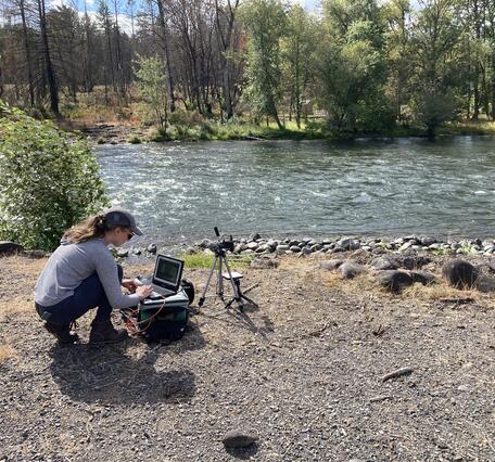 USGS scientist collecting ground data during a UAS mission along the North Santiam River 