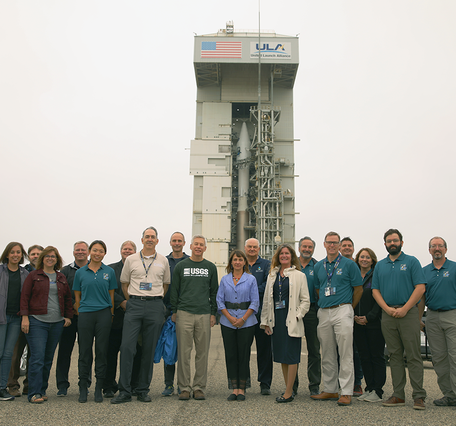 Color photo of USGS officials at Space Launch Complex 3 