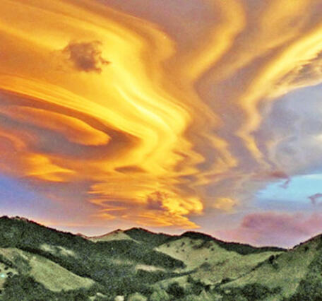 Lenticular clouds over hills in New Zealand.