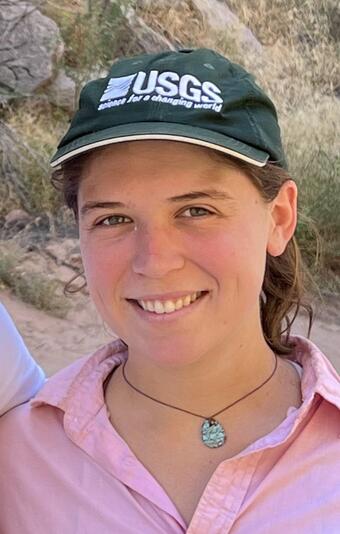 Staff profile photo of Shannon Sartain, wearing a USGS cap