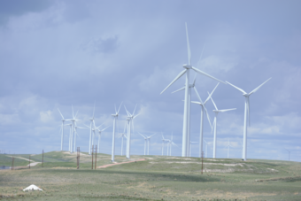 Wind turbines with blue sky in background