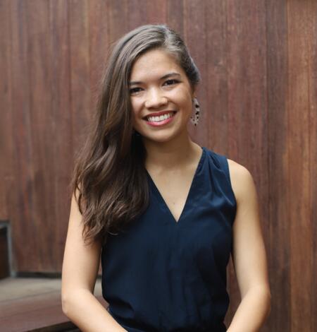 Photo of Sabine Loos standing in a black blouse