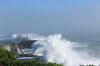 Large waves breaking on cliffs in Santa Cruz, California