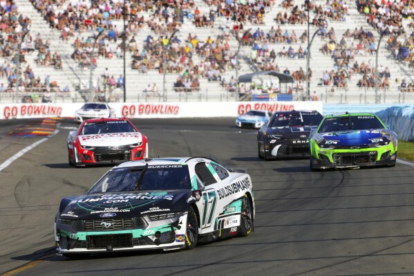 Chris Buescher (17) competes during a NASCAR Cup Series auto race, Sunday, Sept. 15, 2024, in Watkins Glen, N.Y. (AP Photo/Lauren Petracca)