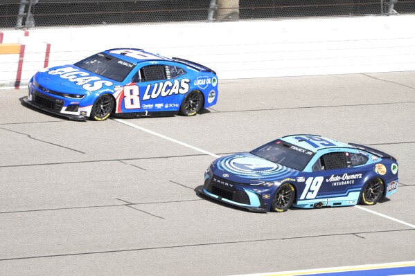 FILE - Kyle Busch (18) and Martin Truex Jr. (19) drive during a NASCAR Cup Series auto race at Michigan International Speedway, Monday, Aug. 19, 2024, in Brooklyn, Mich. (AP Photo/Carlos Osorio, File)