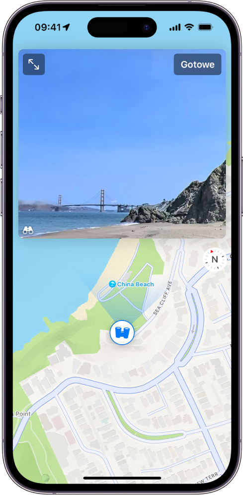 Ruchomy, trzystusześćdziesięciostopniowy panoramiczny widok ulicy wyświetlany powyżej mapy danego obszaru. Nałożona na mapę ikona Rozejrzyj się wskazuje kierunek widoku.